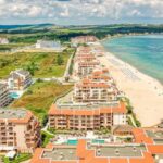 Beach Resorts - Aerial Photography of Buildings Near a Beach