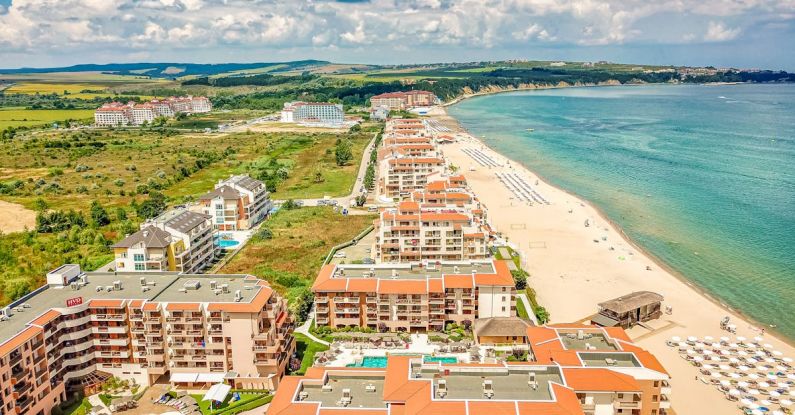 Beach Resorts - Aerial Photography of Buildings Near a Beach
