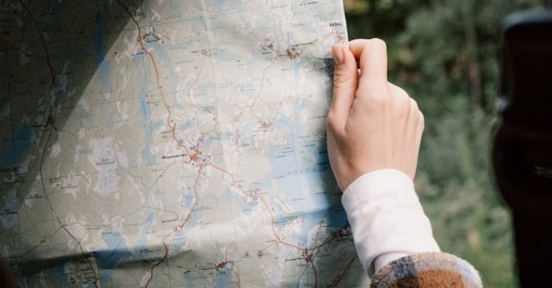 Itinerary - A Person Holding a Map