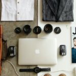 Essentials - Brown Leather Bag, Clothes, and Macbook