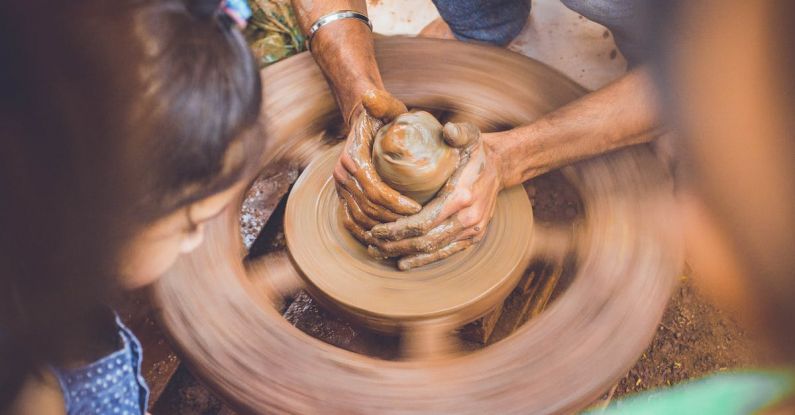 Experience - Person Making Clay Pot in Front of Girl during Daytime
