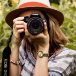 Photography - Selective Focus Photography of Woman Holding Dslr Camera